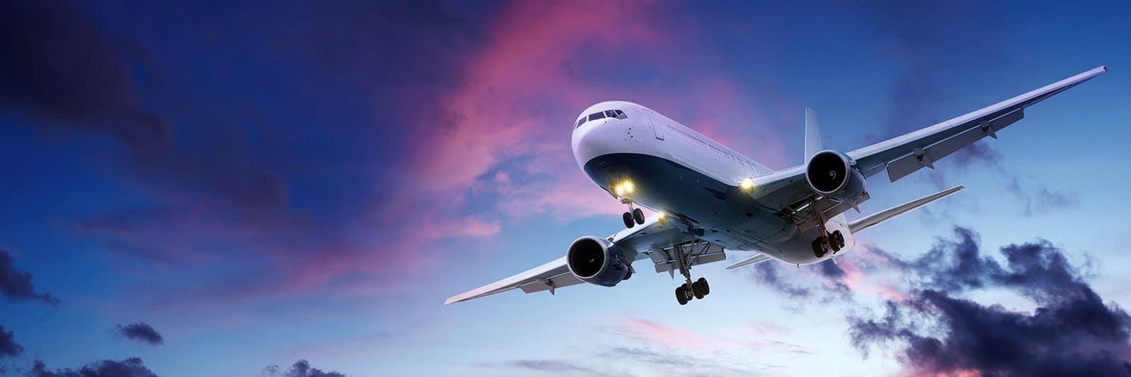 Cargo aircraft landing at dusk