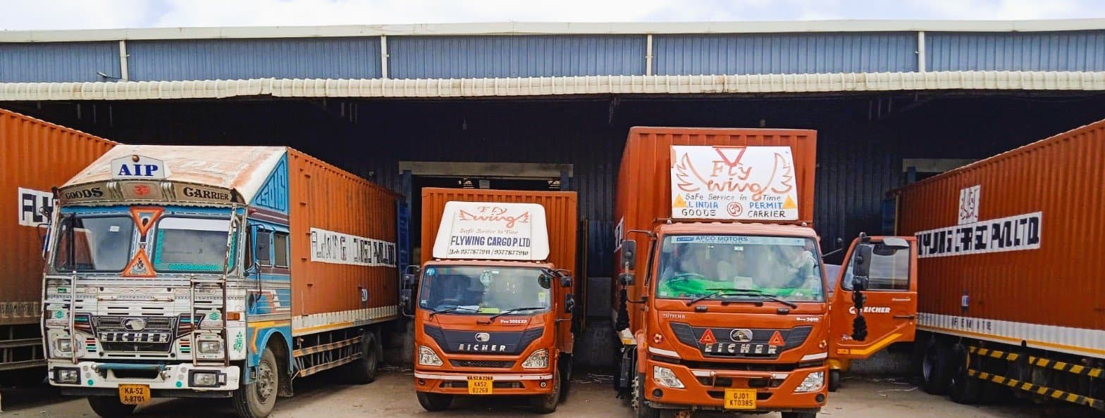 Flywing Cargo branded trucks lined up at the Aslali hub